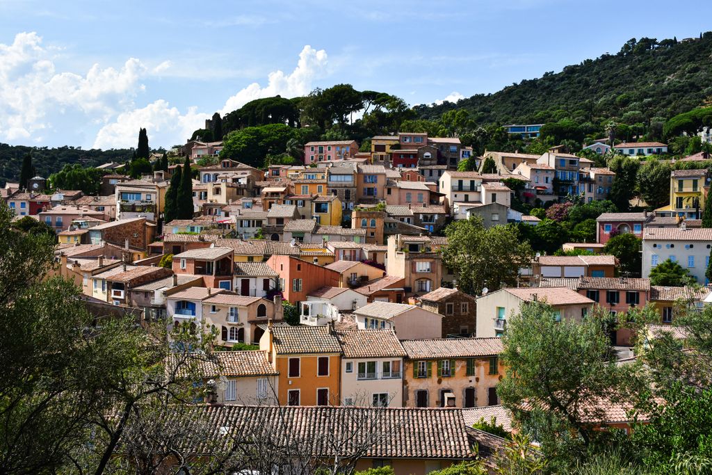 Scenic view of colorful houses in Bormes-les-Mimosas, French Riviera landscape.